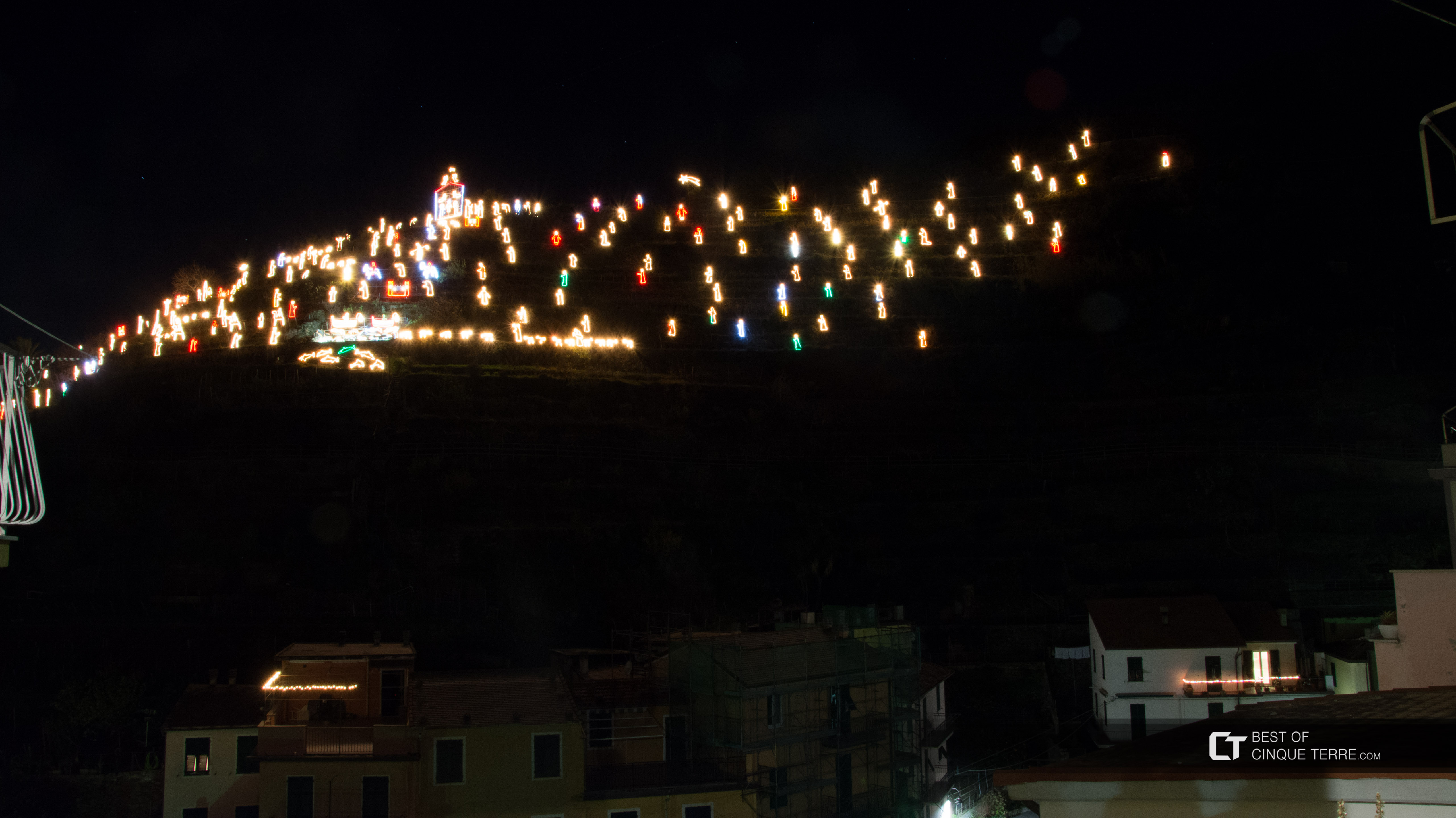 Christmas nativity scene (Presepe), seen from the main square of the village, Manarola, Cinque Terre, Italy